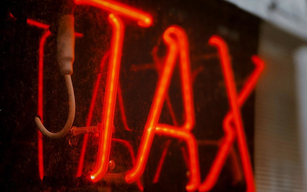 luminous tax symbol