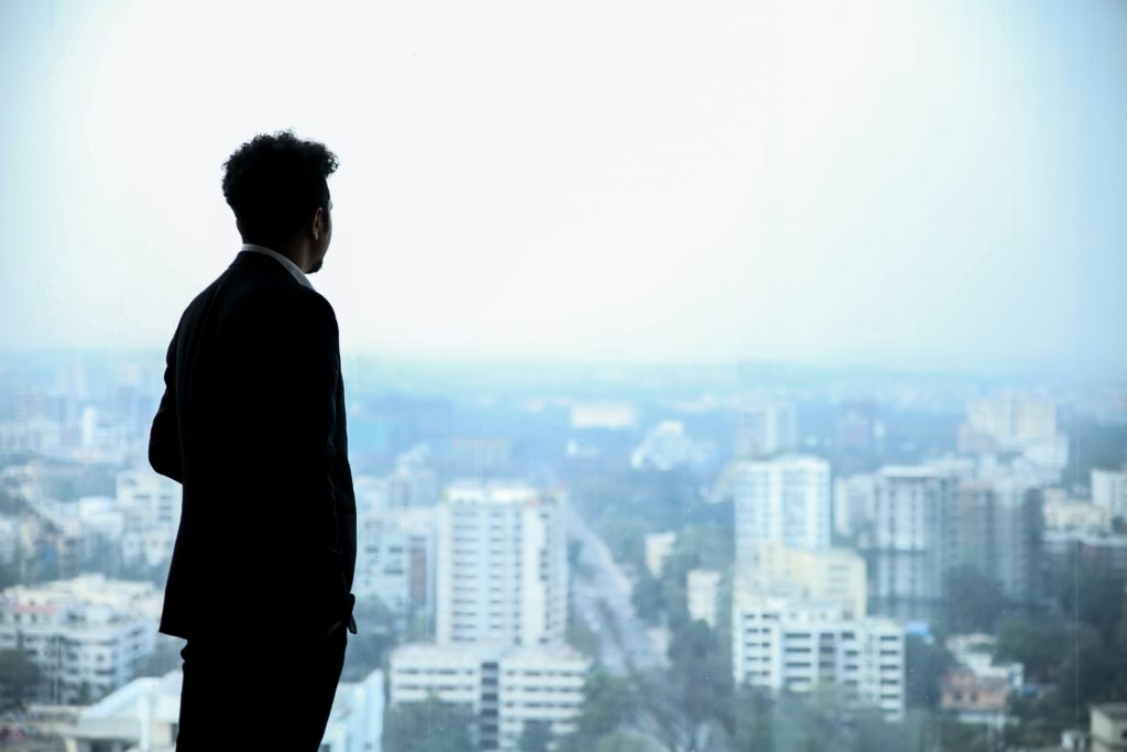 image of a man staring over the landscape
