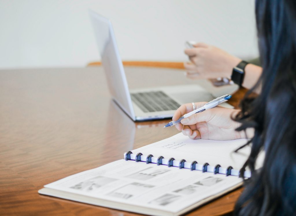 image of a woman writing
