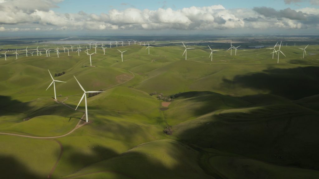 a green field with anemometer